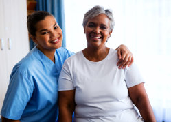elder woman and staff smiling