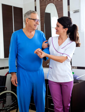 staff and elder man smiling