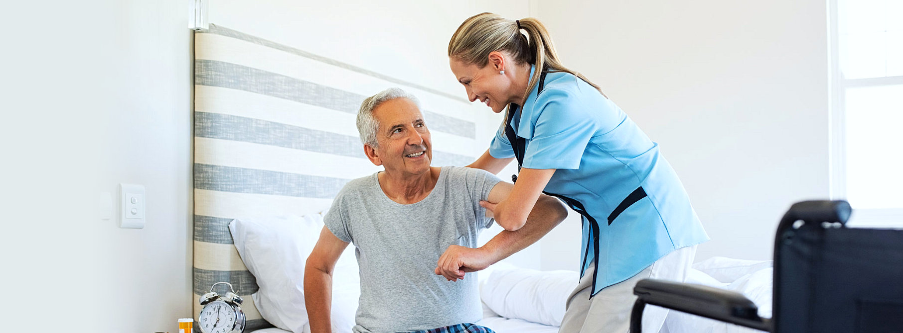 staff	assisting elder man