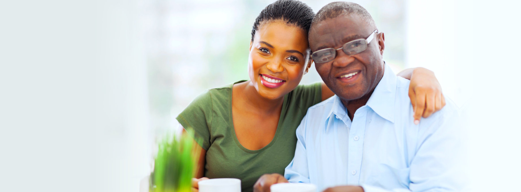 staff and elder man smiling