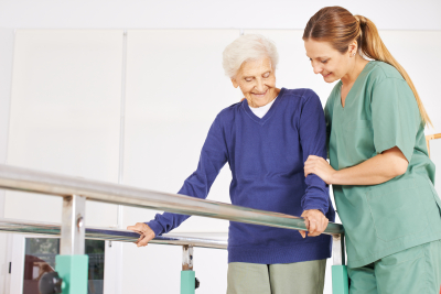 caregiver helping senior woman