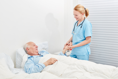 nurse and senior smiling